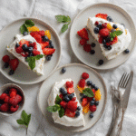 The Best Pavlova Toppings to Try Today (Sweet & Savory Ideas) 3 Sliced pavlova with fruit and cream toppings