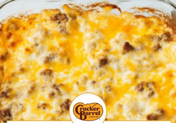 Delicious Biscuits and Gravy Casserole topped with sausage and gravy