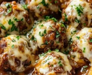 Delicious Crockpot French Onion Meatballs served with cheese on top