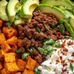 Colorful and nutritious sweet potato taco bowl with fresh toppings and ingredients